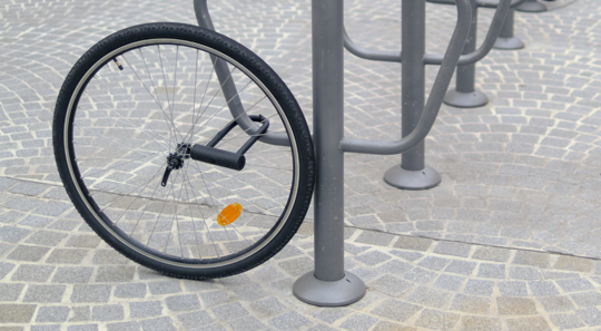 Bicycle tire is locked to a pole but the rest of the bicycle is gone